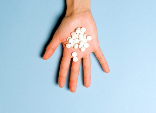 hand and pills